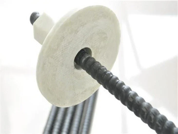Manufacturer product photograph of a solid FRP rod, bearing plate and nut