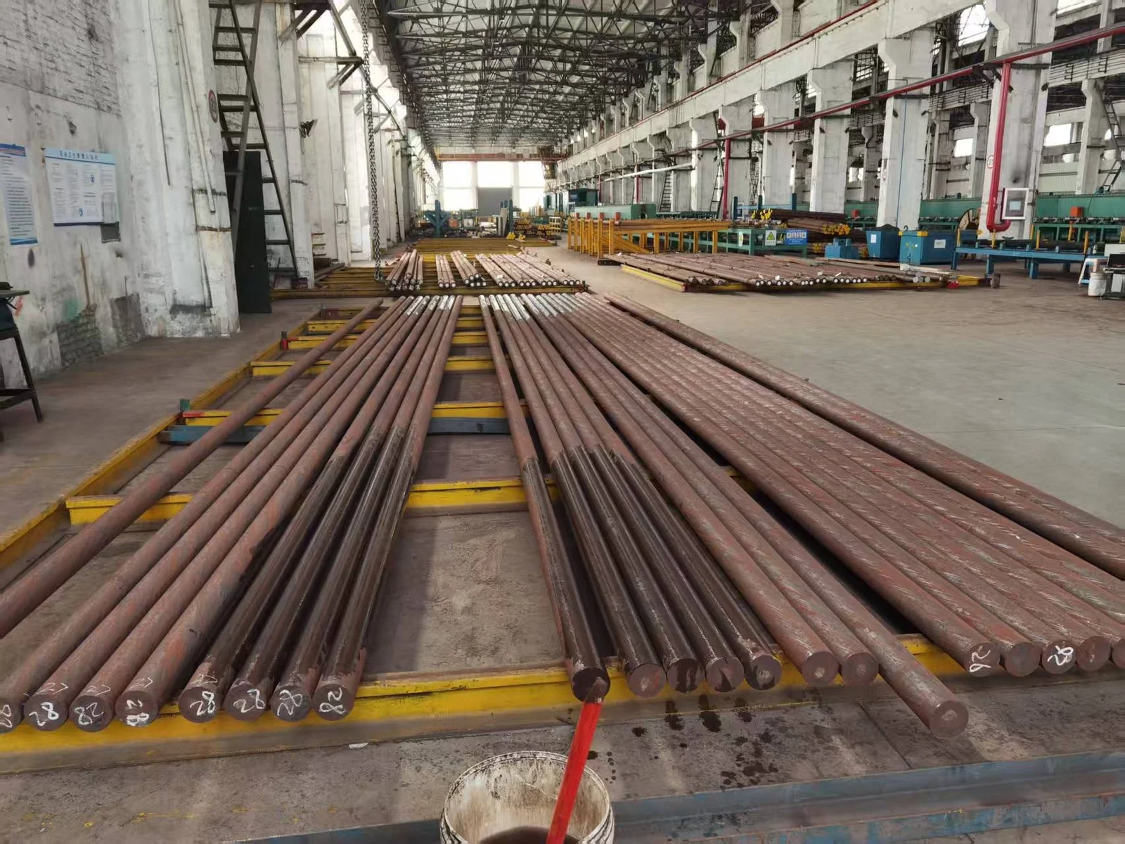 Round steel bars stored in a warehouse
