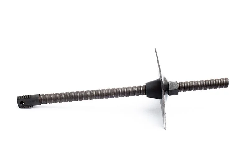 Manufacturer photograph of a steel self-drilling bolt with drill bit, plate and nut