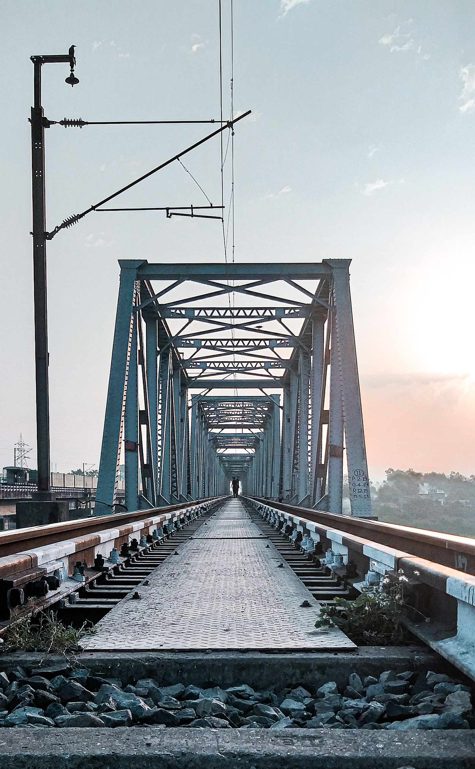 Steel railway bridge carrying an electrified transport route