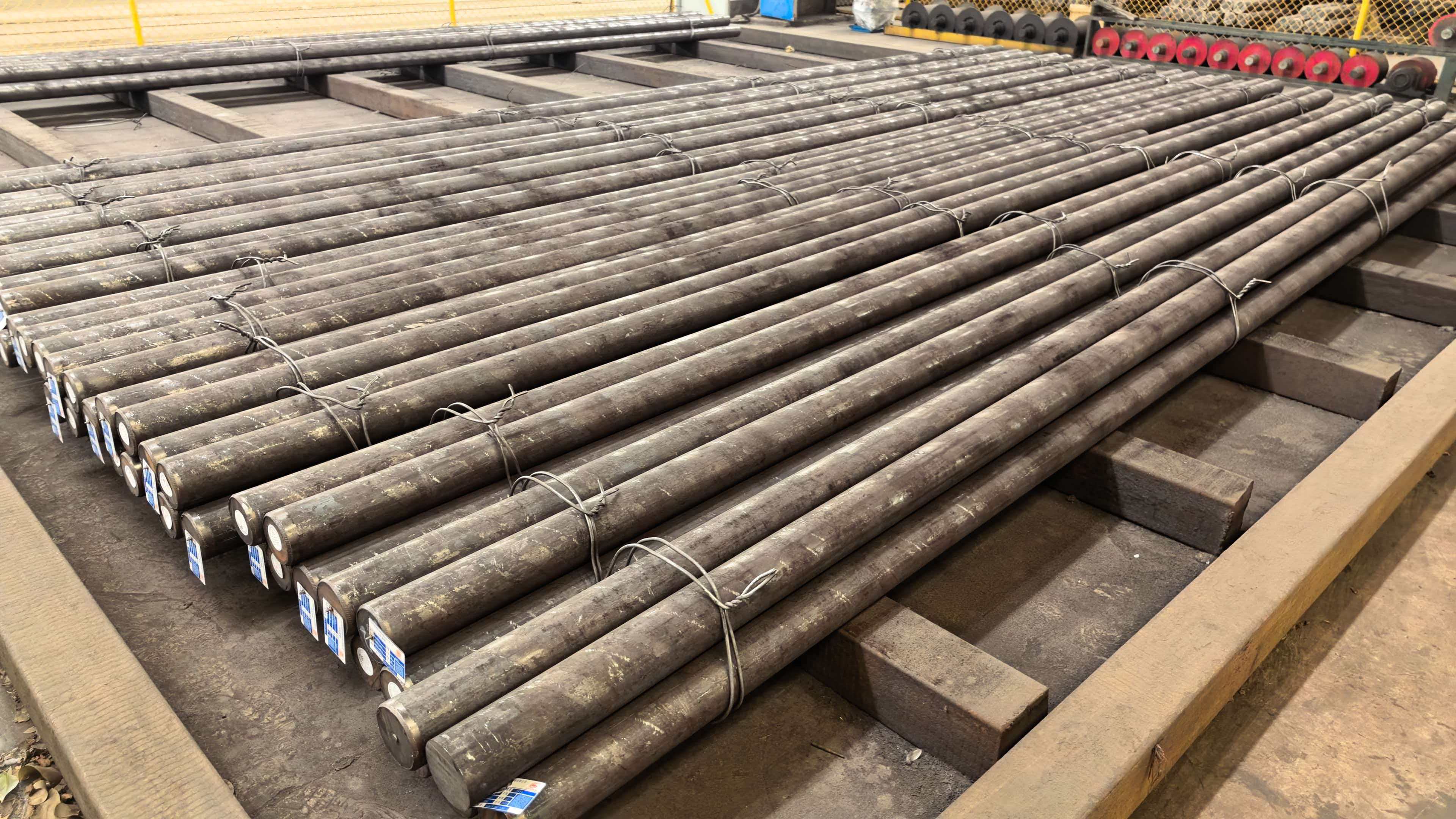 Bundled round steel bars arranged in warehouse storage