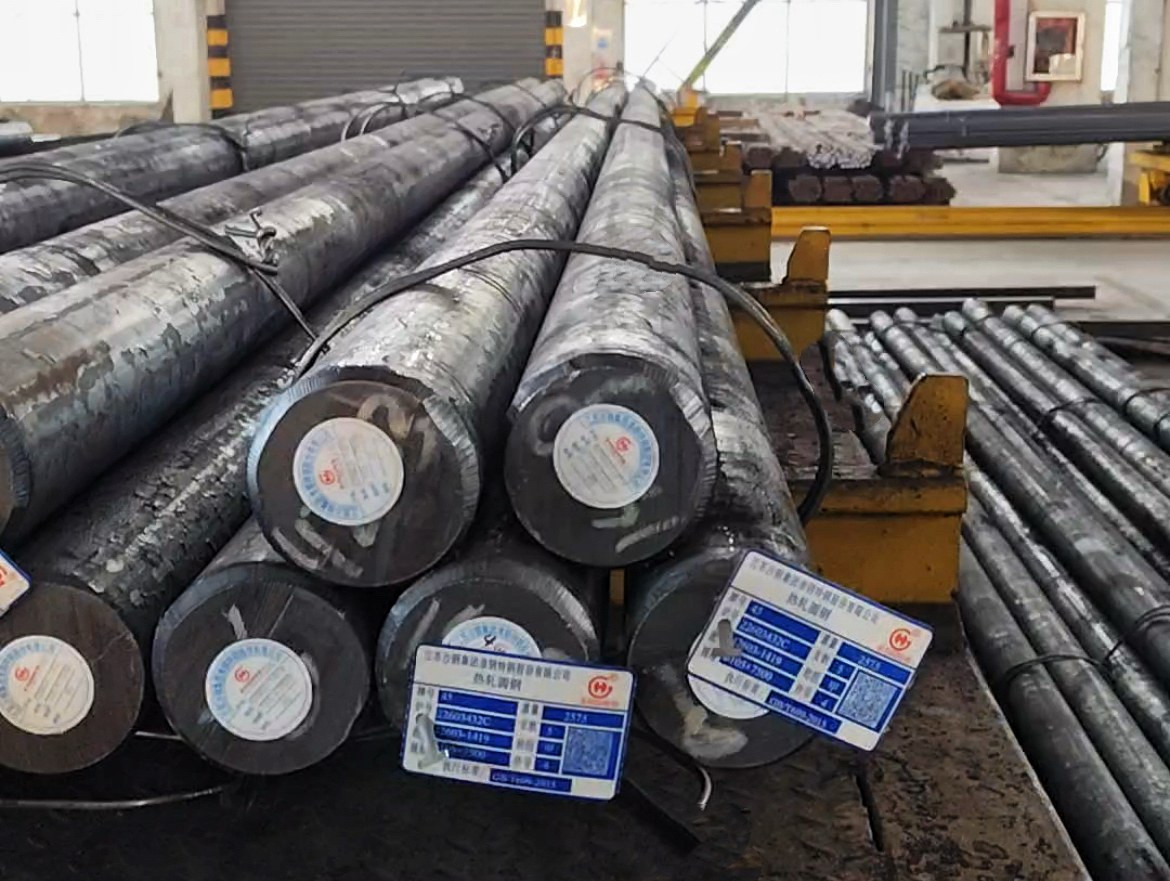 Large and small round steel bars arranged with identification tags