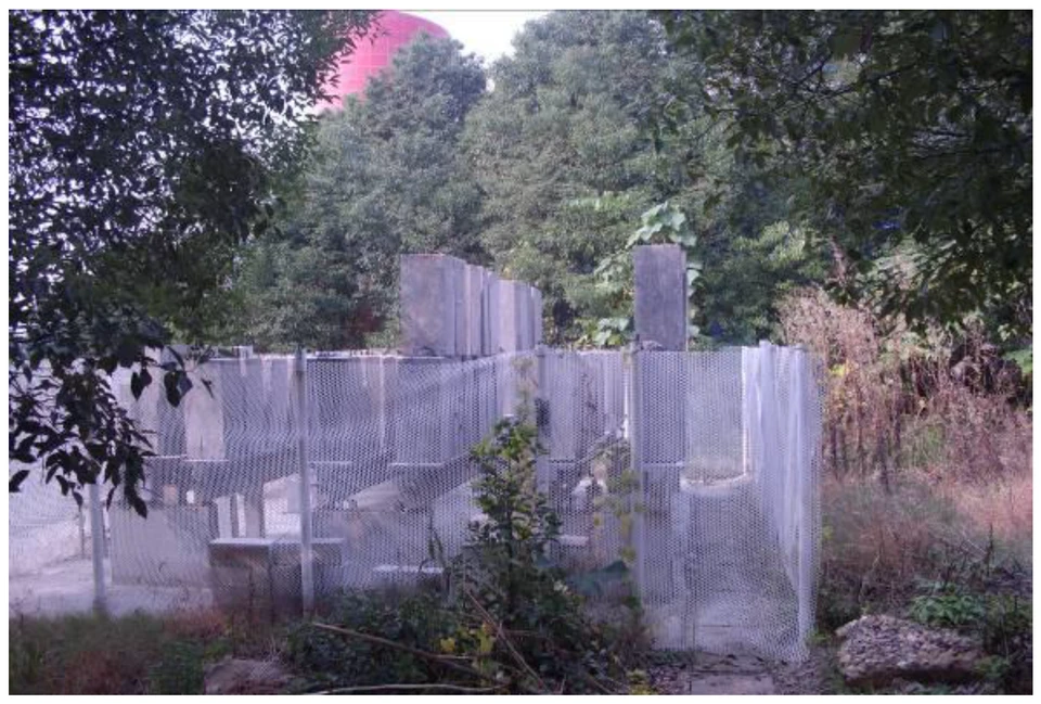 Outdoor prestressed-concrete T-beam test station used to investigate interacting long-term losses