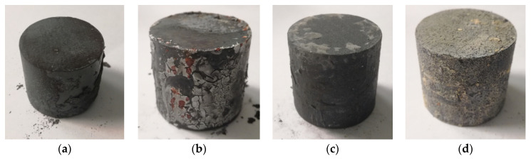 Four cylindrical C45 samples show different scale appearances after a five-minute exposure at 1200 degrees Celsius.